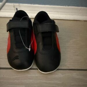 Brand new Puma Kids Black and Red Sneakers